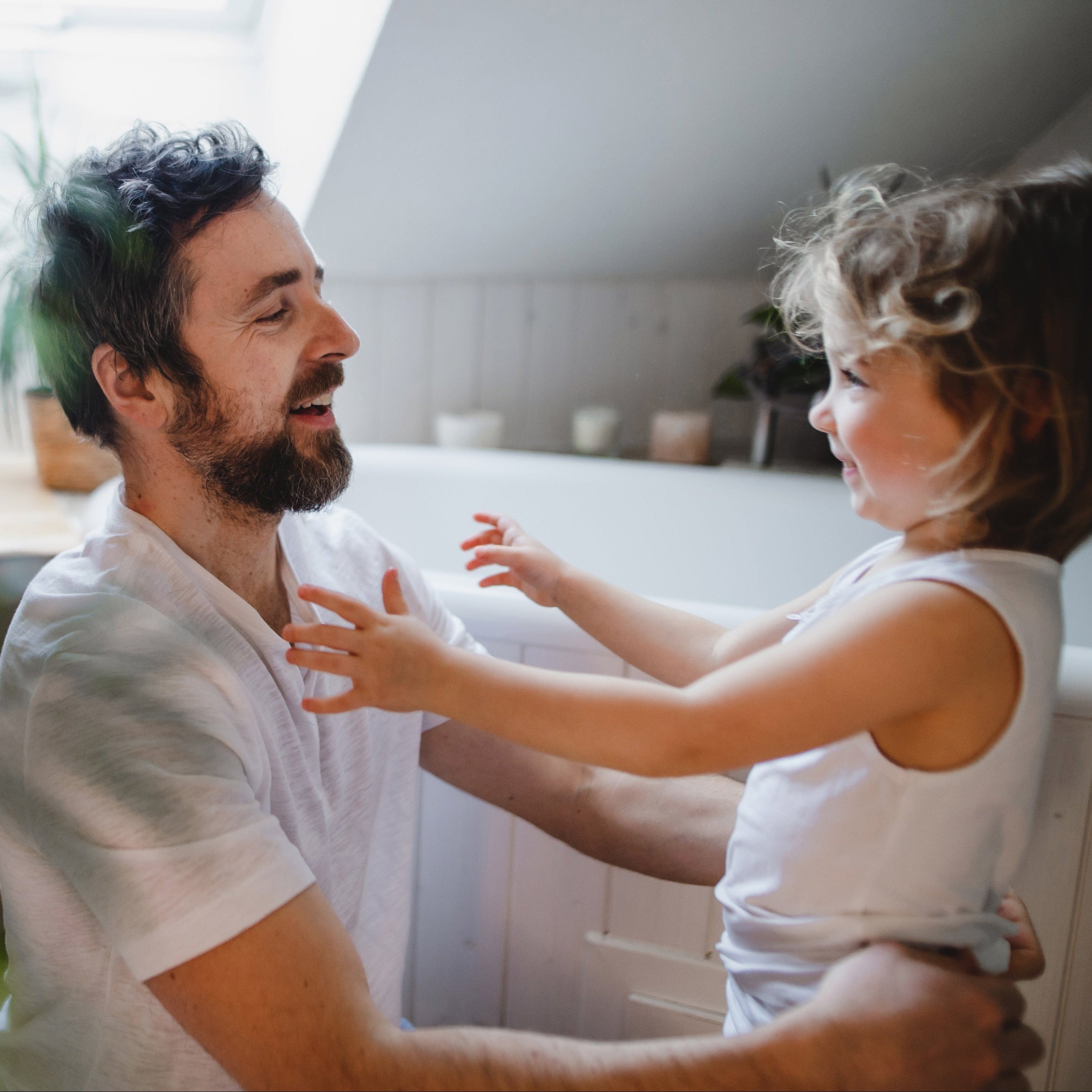 mature-father-with-small-daughter-indoors-at-home-2022-01-19-00-01-33-utc.jpg